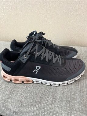 On Running Dark Gray and White women’s Lightweight Runners